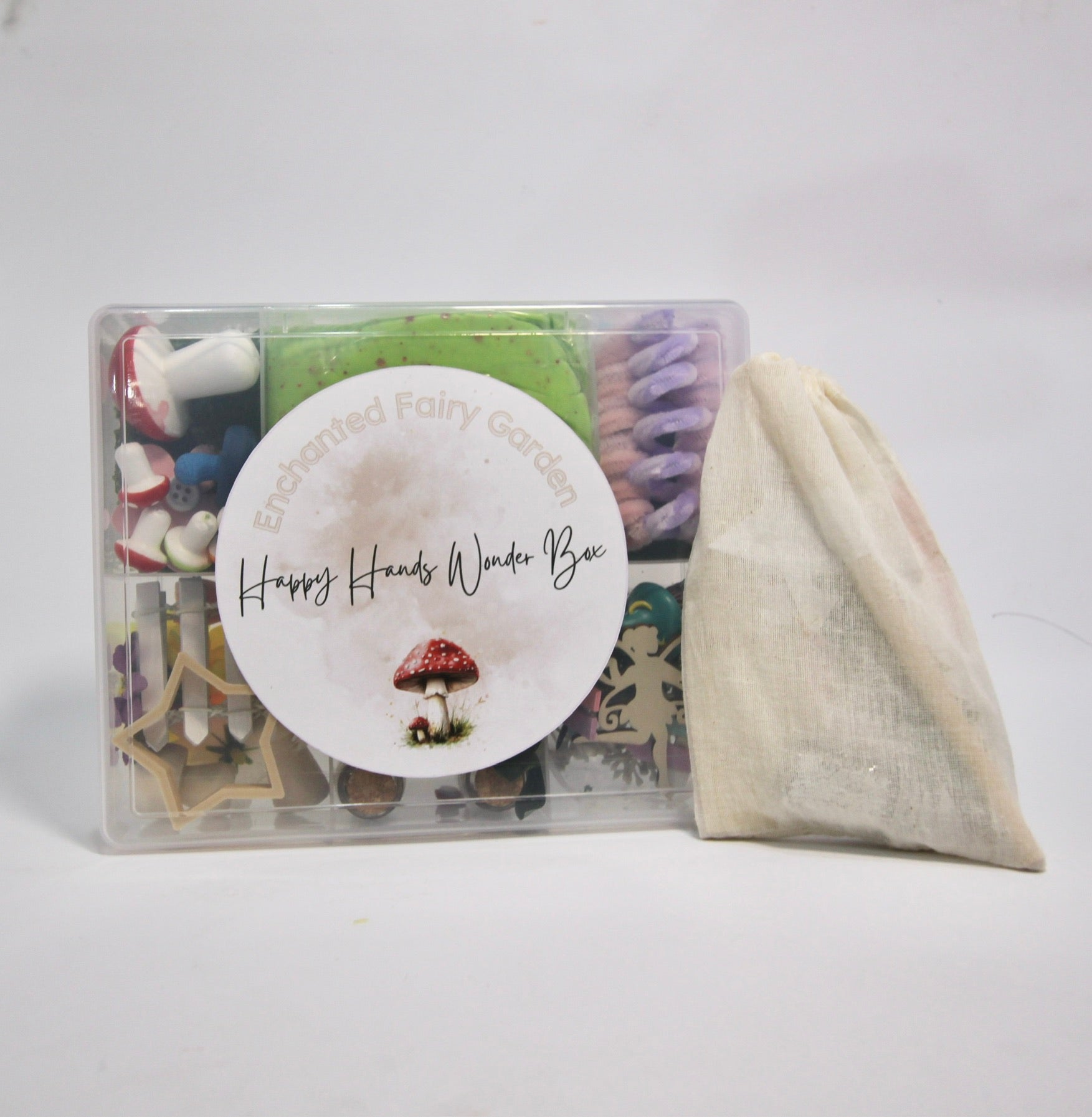 Happy Hands Wonder Box with fairy garden items and a drawstring bag on a white background
